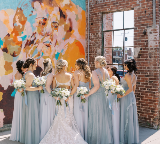 Outdoor Bridesmaid portraits with colorful mural in downtown York